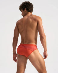 Orange men’s score sheer briefs with subtle textured pattern and team logo printed on the waistband