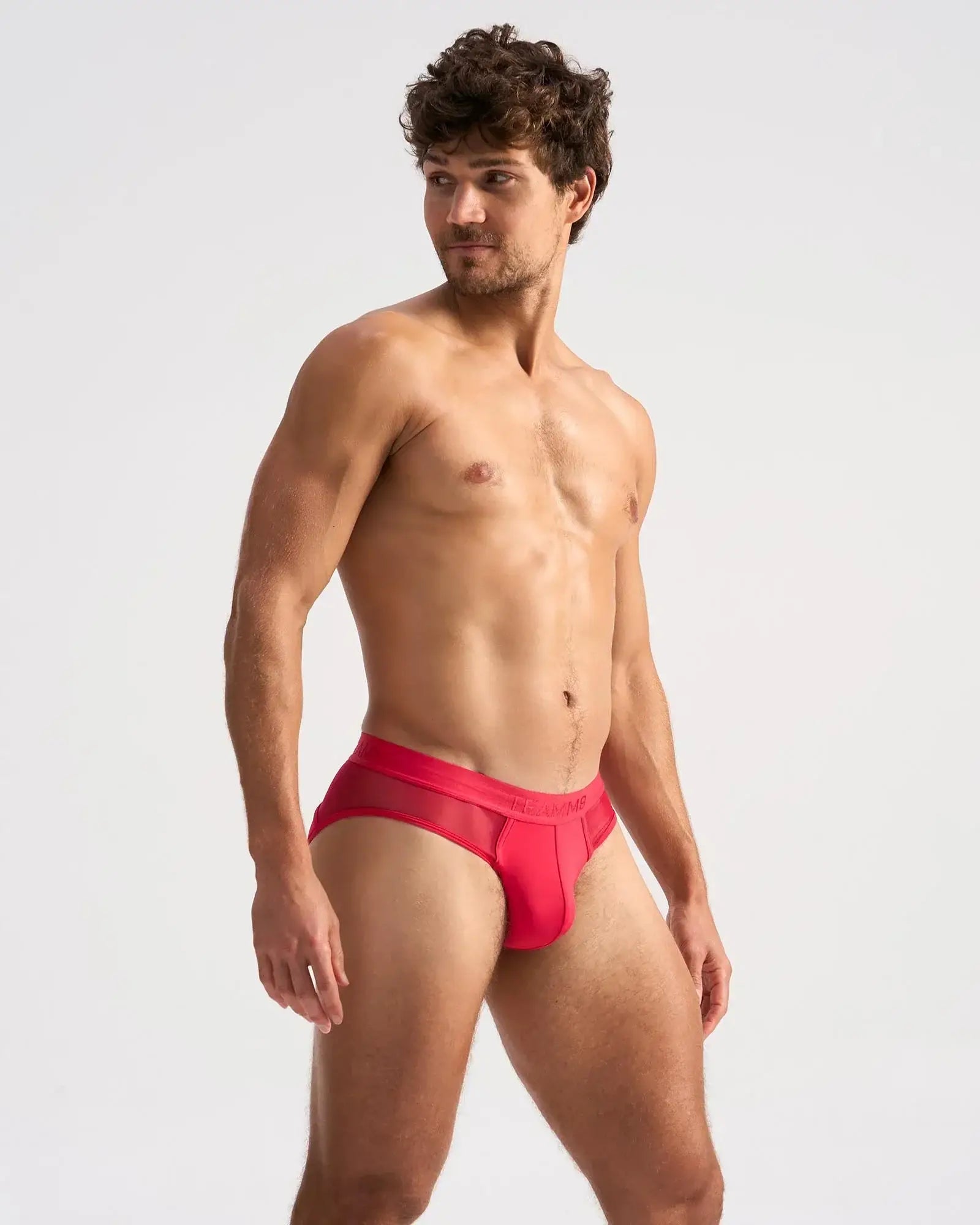 Red men’s SCORE SHEER brief with a mesh side panel offering breathability and comfort