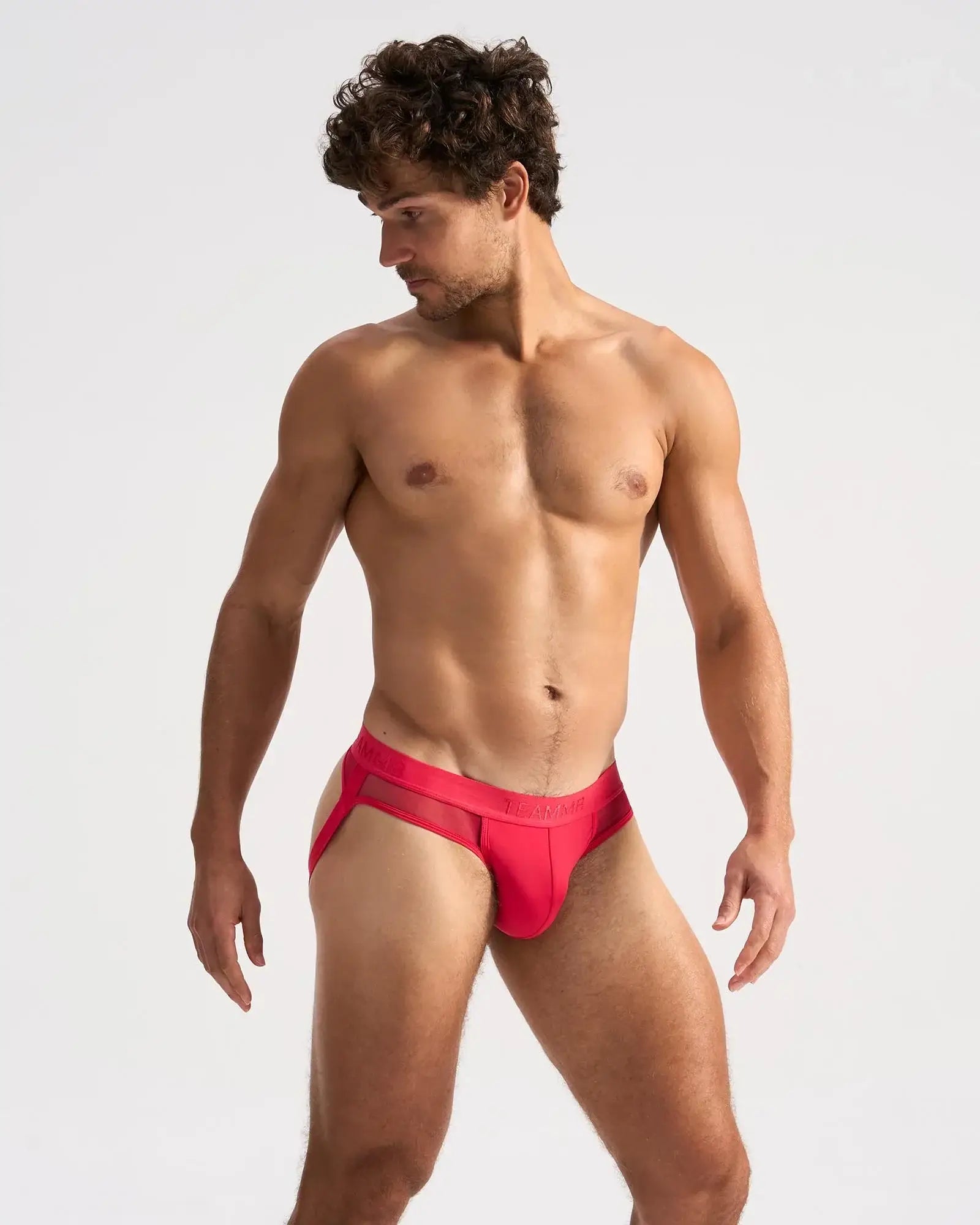 Vibrant red score sheer jock briefs with mesh trim and sleek form fitting design for comfortable everyday wear