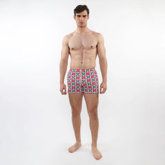 Seersucker swim shorts with mesh lining featuring vibrant red blue and white geometric patterned men’s swim trunks