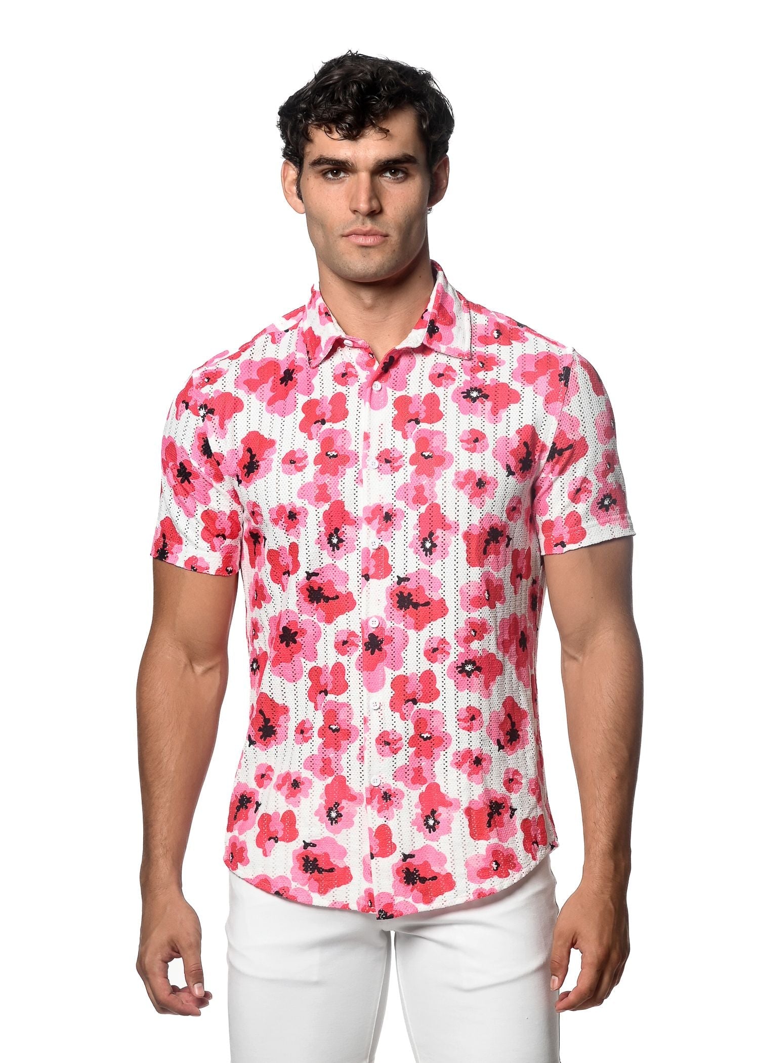A man wearing a floral print open knit short-sleeved button-up shirt with vibrant pink flowers on white background