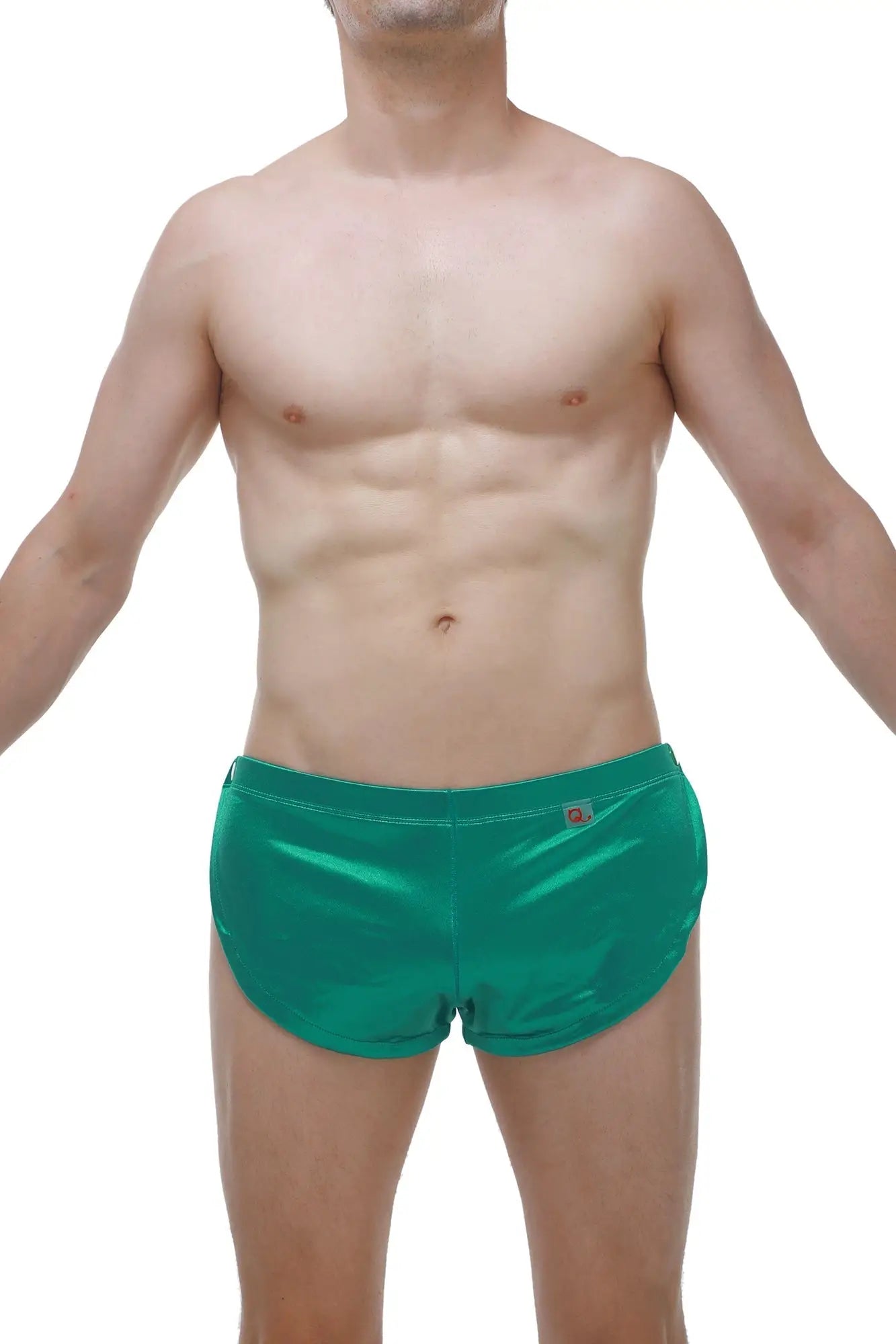 Short snap satin green shiny emerald green swim trunks with subtle logo on waistband visible from front side