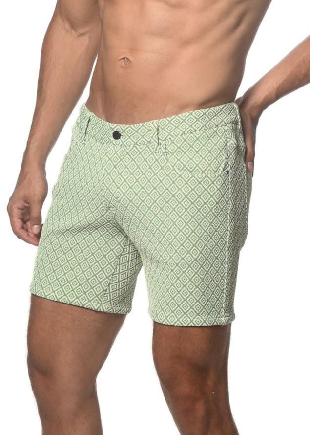 Light green jacquard printed stretch knit shorts with darker green geometric pattern button closure and belt loops
