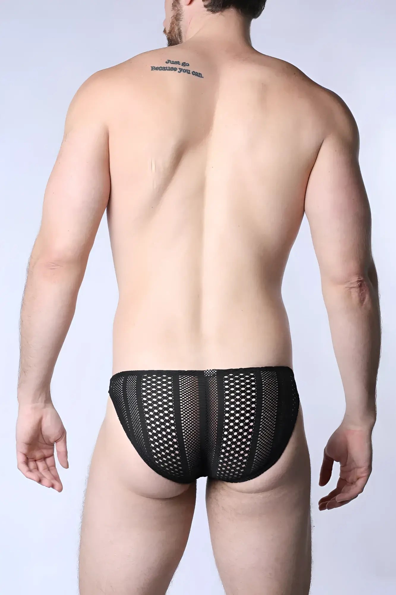 Black mesh sicily crochet low rise swim brief featuring small evenly spaced holes in the fabric