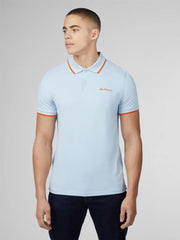 Light blue signature polo shirt with orange collar and cuff trim and small embroidered chest logo