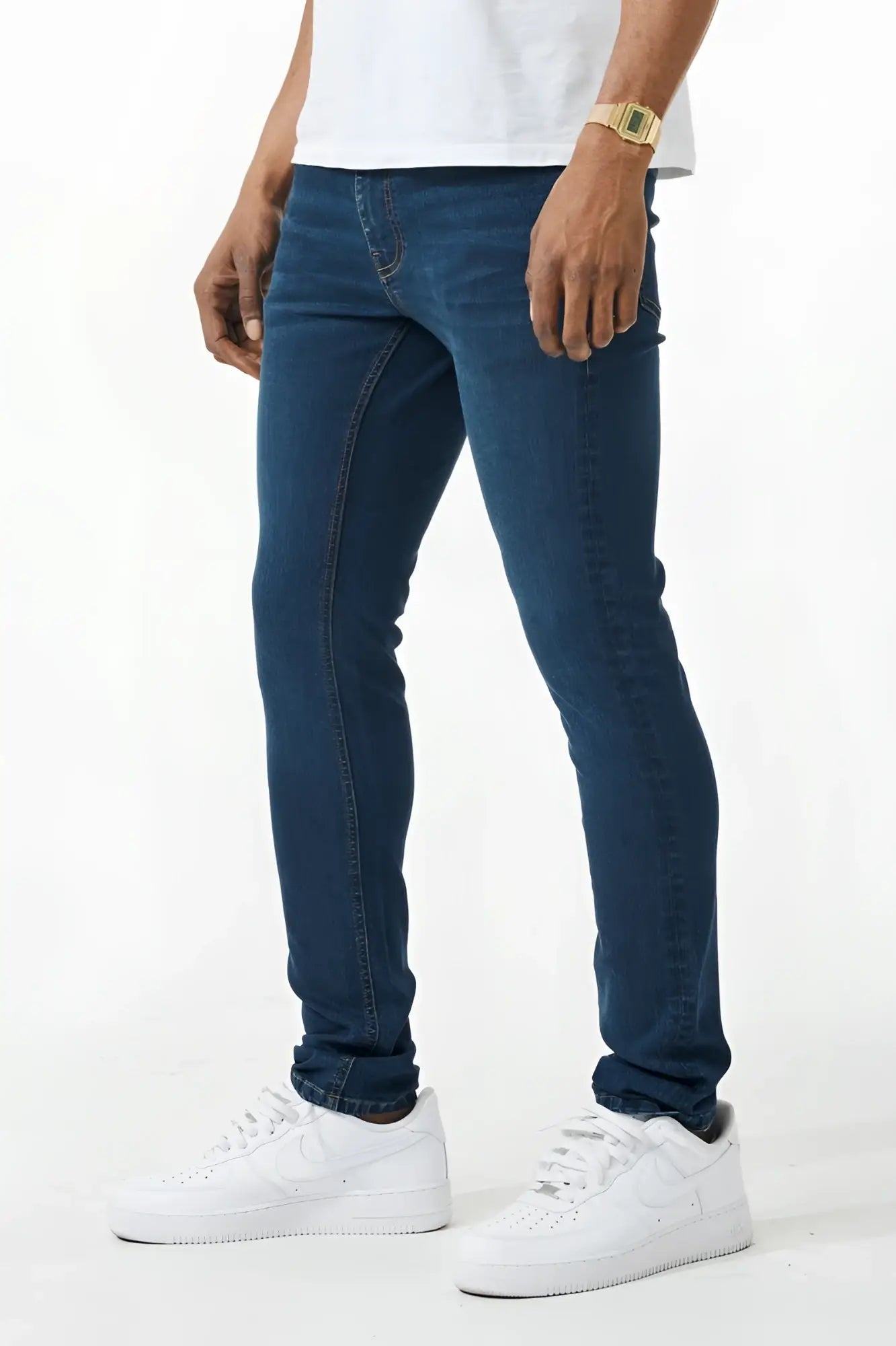 Dark blue skinny fit denim jeans with slim fit, classic five-pocket design, and subtle thigh fading