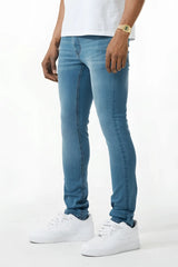 Light-wash blue skinny fit denim jean with classic five-pocket design and subtle fading along the thighs