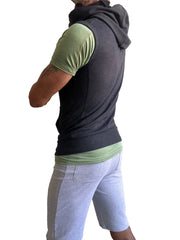 Black sleeveless yoga hoodie charcoal gray worn over green short-sleeved shirt for casual layering