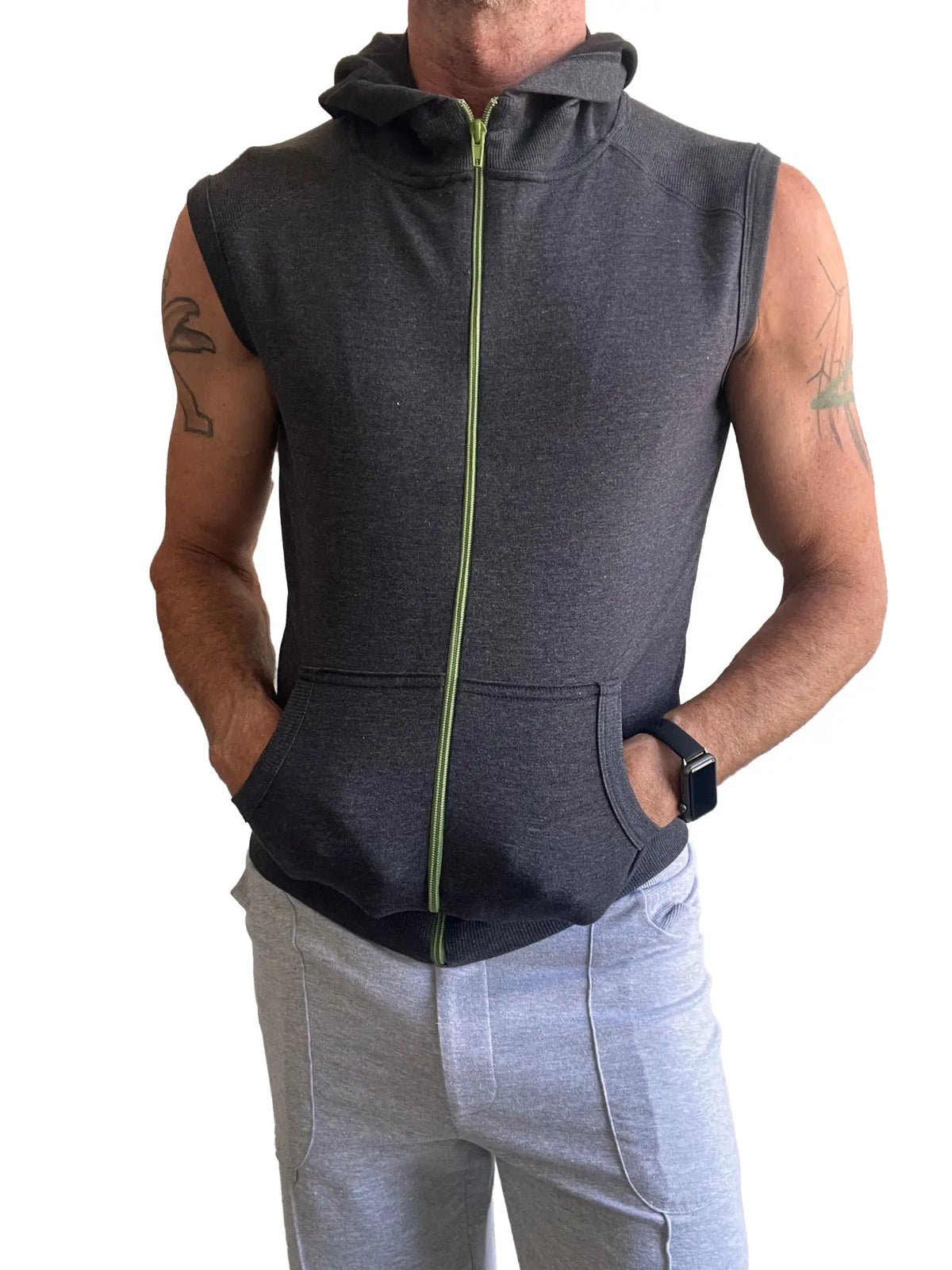 Charcoal gray sleeveless yoga hoodie with lime green zipper and front pockets designed for comfort and flexibility