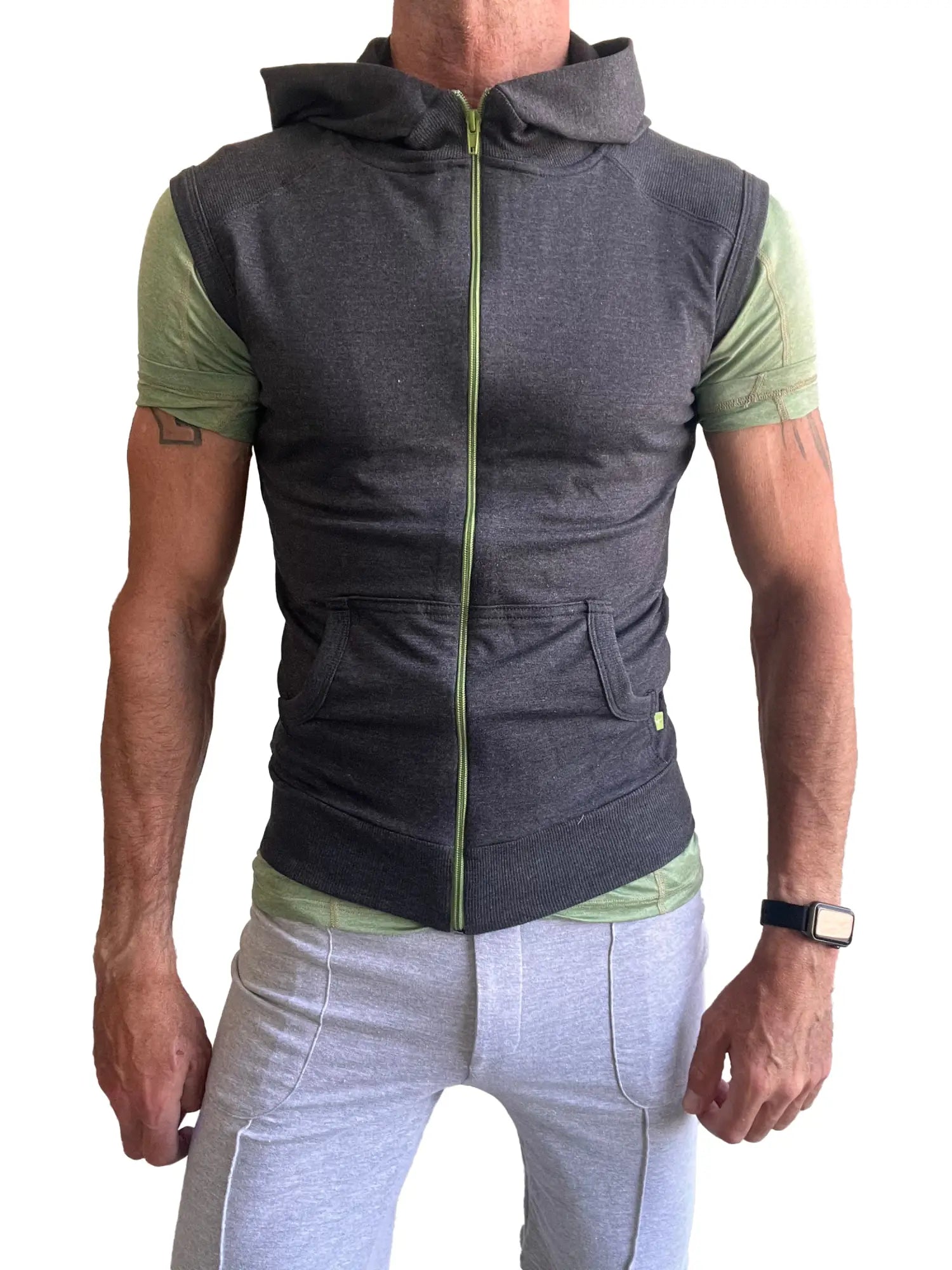 Sleeveless yoga hoodie charcoal gray zip-up vest with lime green zipper and sleeve accents over matching shirt
