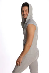 A heather grey sleeveless yoga hoodie with a hood and front zipper made of soft fabric for comfortable wear