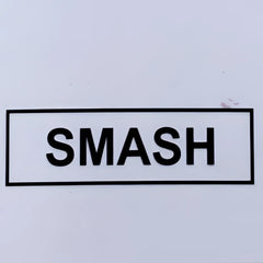 Black smash sticker with bold uppercase lettering inside a rectangular border on the smash gossamer lace top product