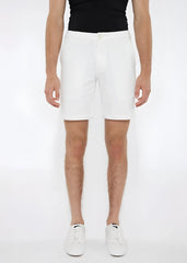 White solid stretch knit shorts with a tailored fit and subtle side pockets made from cotton material