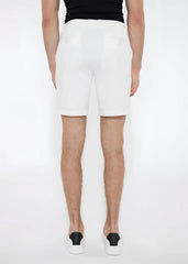White solid stretch knit shorts with a clean tailored fit and subtle back pockets shown from the back side