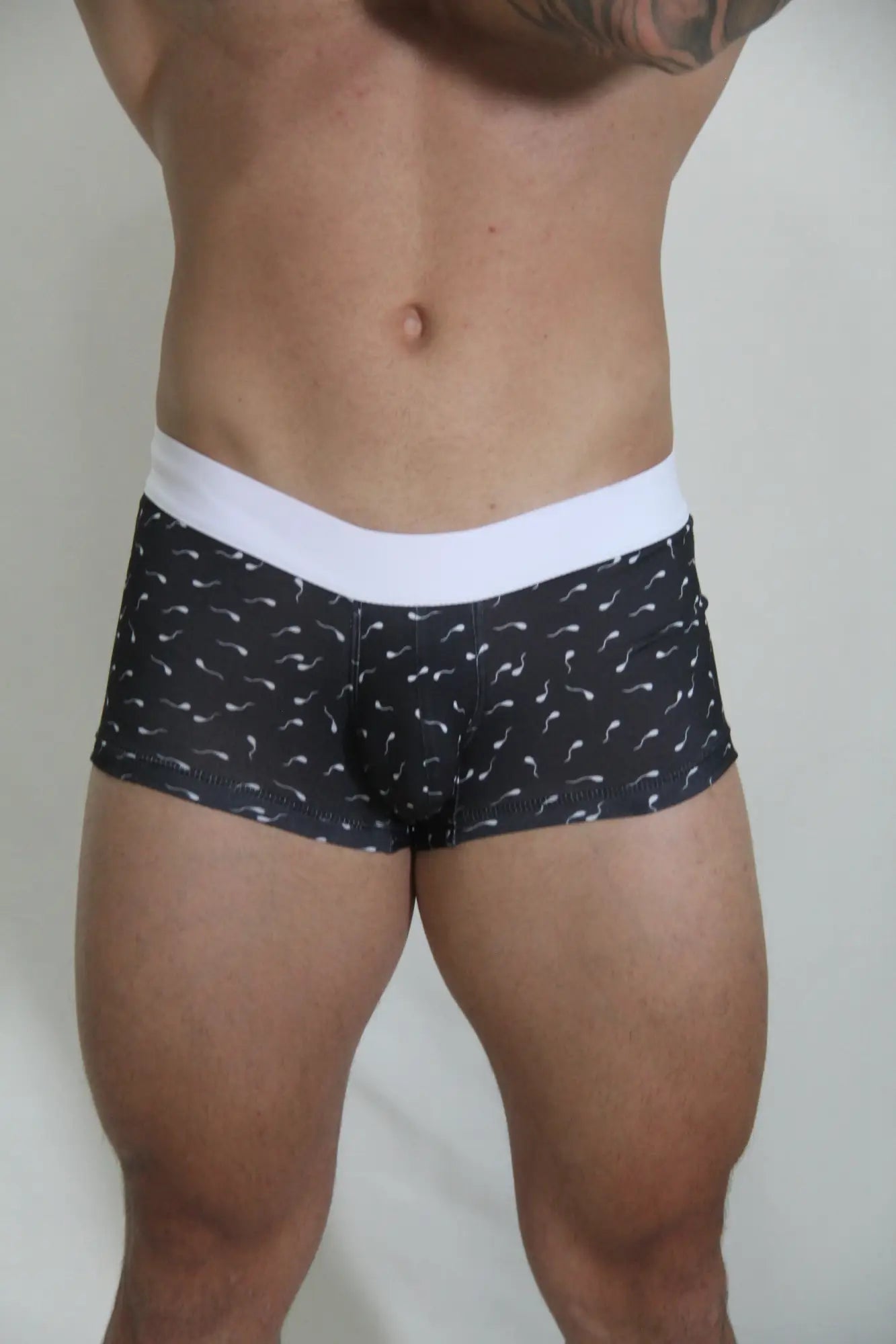 Black sperm trunk boxer briefs with white elastic waistband and light mustache pattern for everyday comfort