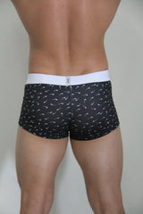 Black sperm trunk boxer briefs with white waistband and white stylized sperm cell pattern for everyday comfort