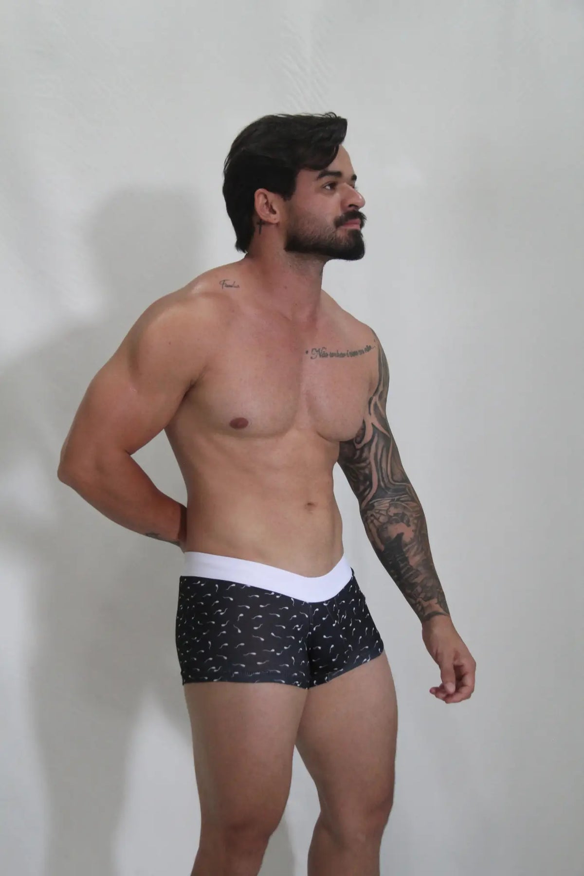 Black sperm trunk briefs with white waistband and small light-colored bird patterns for everyday comfort