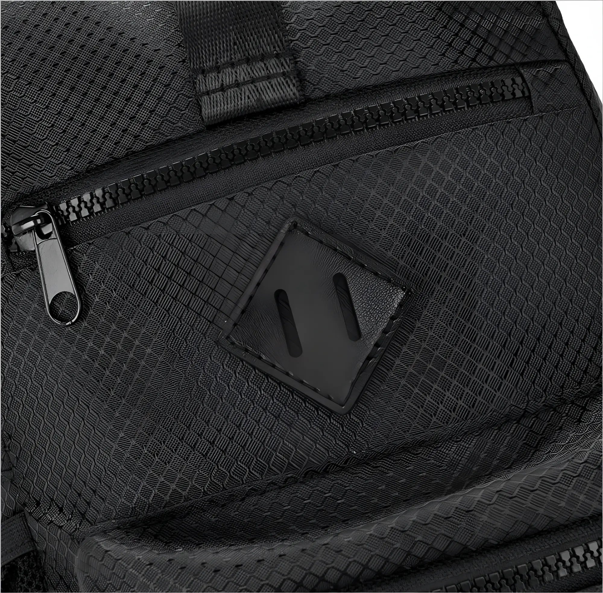 Black sport crossbody sling bag with mesh texture diamond-shaped leather patch and black zipper details