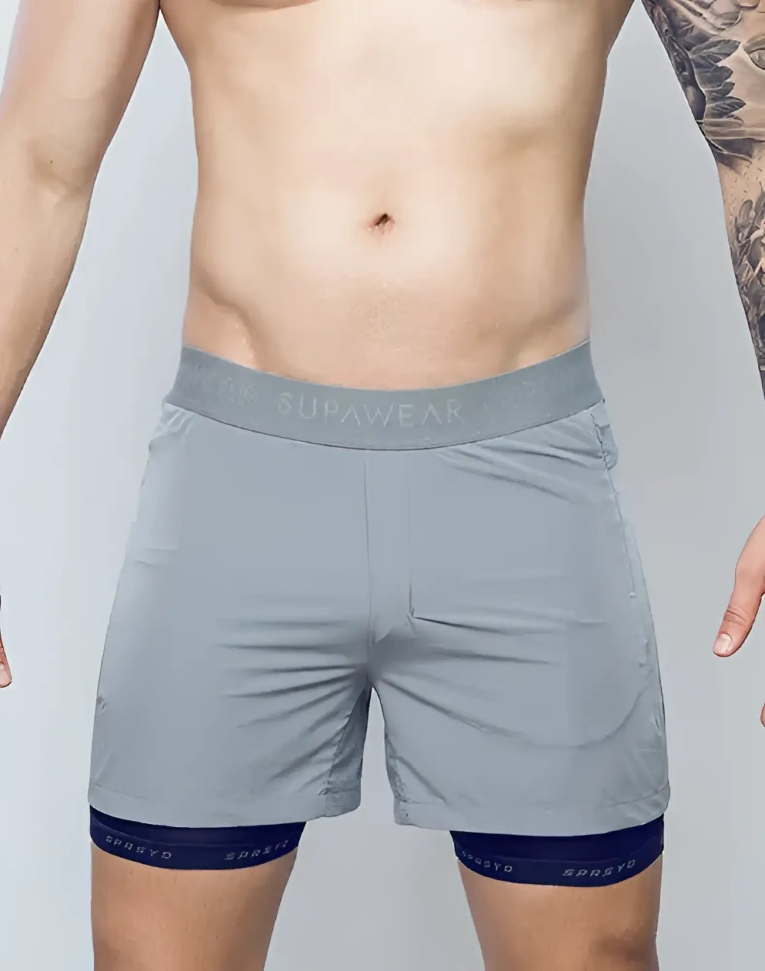 Gray spr flex short supawear athletic shorts with matching waistband and navy blue trim at the hem