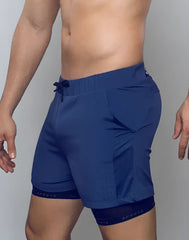 Navy blue spray max short athletic shorts with mesh side panels drawstring waistband and branded inner leg lining