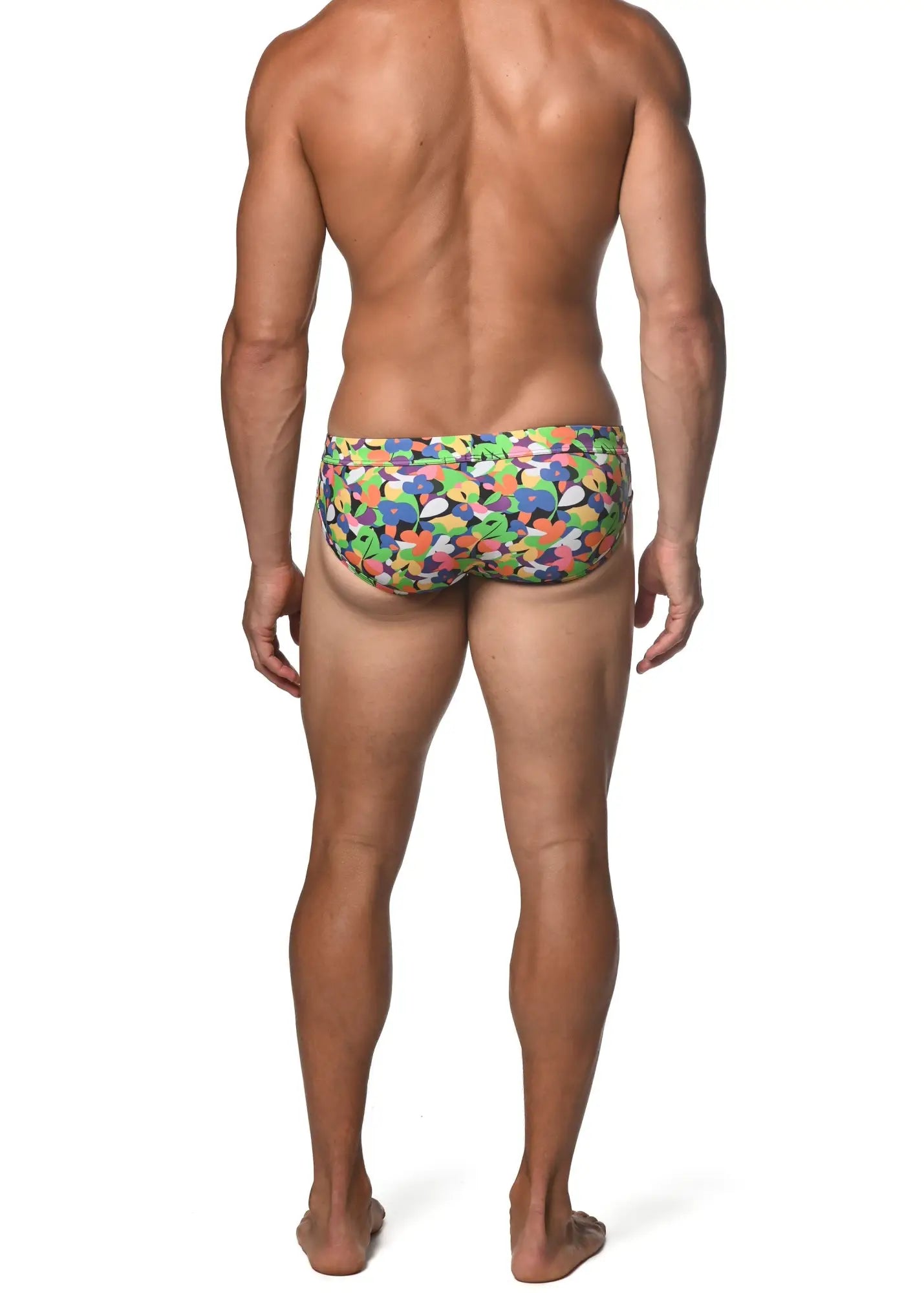 Spring green abstract freestyle swim brief featuring vibrant multicolored swim trunks with playful abstract shapes