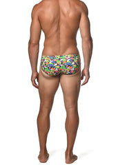 Spring green abstract freestyle swim brief featuring vibrant multicolored swim trunks with playful abstract shapes