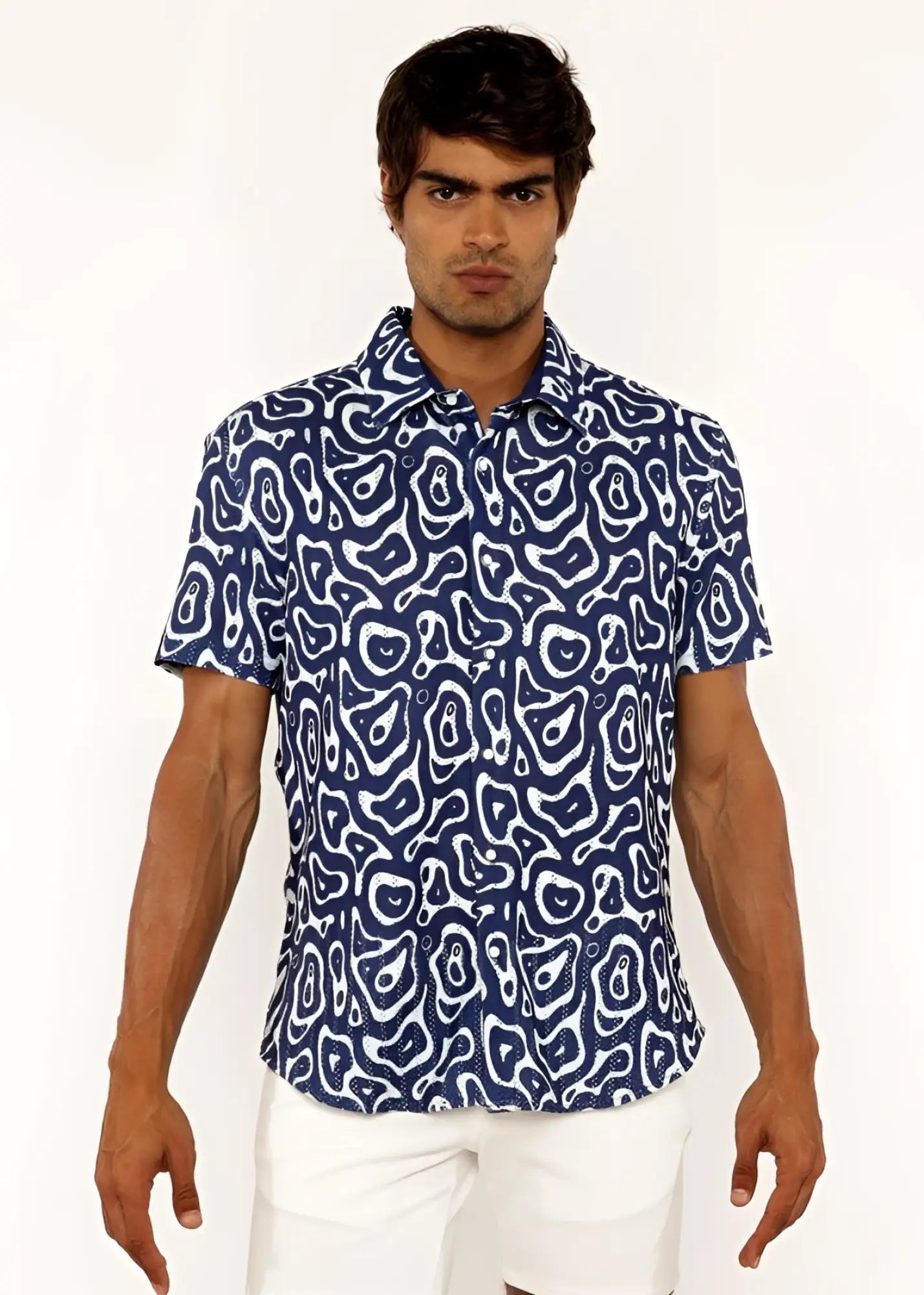 A navy blue short-sleeved squiggly print open knit shirt with a white abstract pattern for casual wear