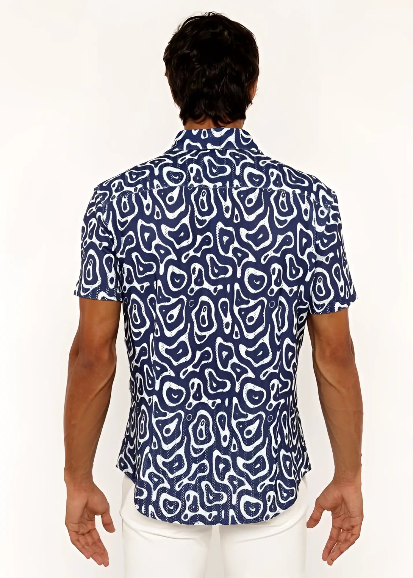 A navy blue short-sleeved squiggly print open knit shirt with bold white abstract pattern and button-up front