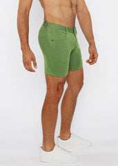 Green stretch knit shorts with classic five-pocket design and belt loop waistband in denim fabric