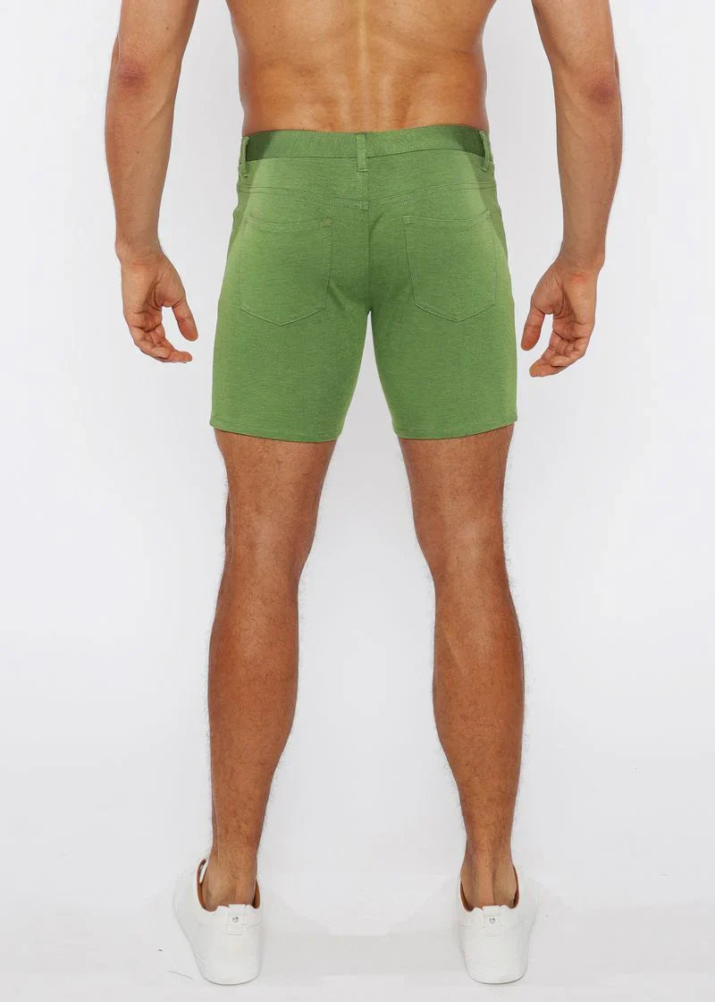 Green stretch knit shorts with straight-leg cut and rear pockets shown from the back side