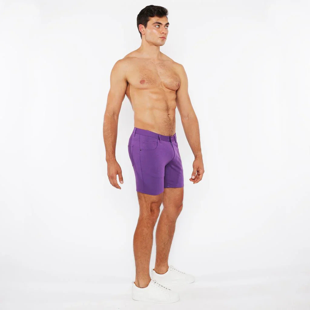 Purple stretch knit athletic shorts with tailored fit and subtle side pockets for comfortable activewear
