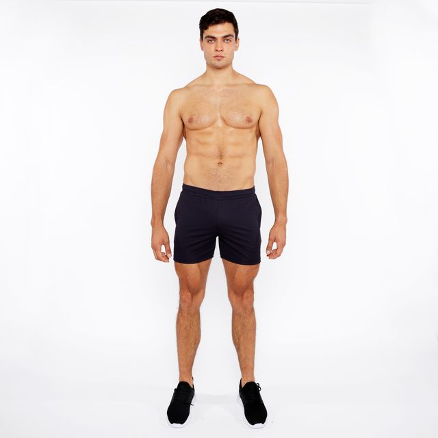Black textured mesh stretch performance shorts with minimalist design for athletic use shown from the front