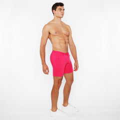 Bright pink stretch knit short with tailored fit and belt loops designed for athletic wear and comfort