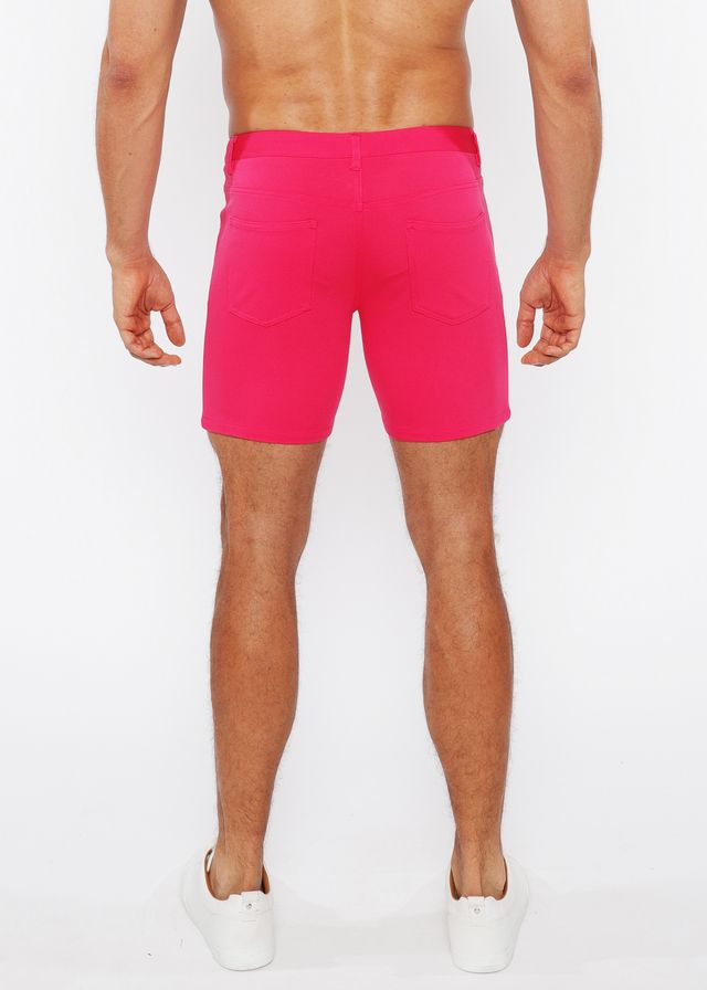 Bright pink stretch knit short with fitted waistband and side pockets for athletic wear