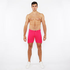 Bright pink stretch knit shorts with classic five-pocket design and button closure for comfortable wear