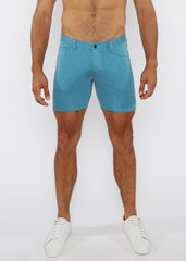 Turquoise stretch knit short in slim fit with textured fabric classic five-pocket design and black button closure