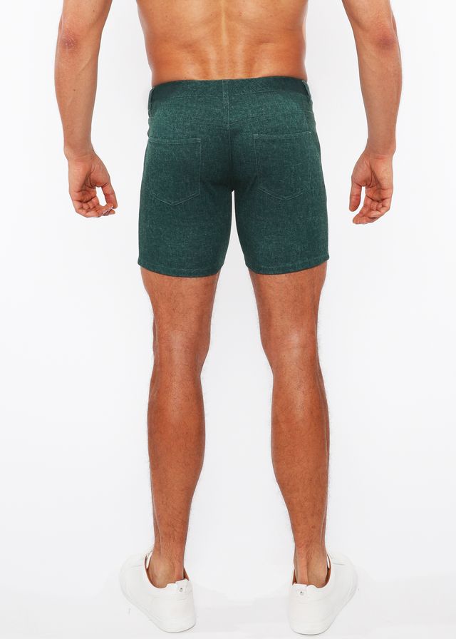 Dark green washed denim stretch knit shorts with subtle texture and two back pockets shown from the back side