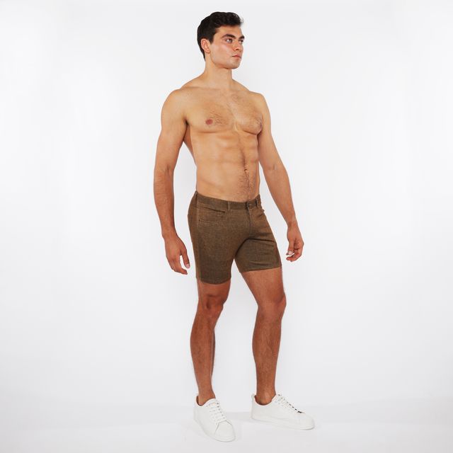 Olive green washed denim stretch knit shorts with textured fabric for comfortable casual wear