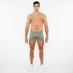 A pair of olive green textured 3 inch stretch knit two tone briefs with a subtle pattern and button closure