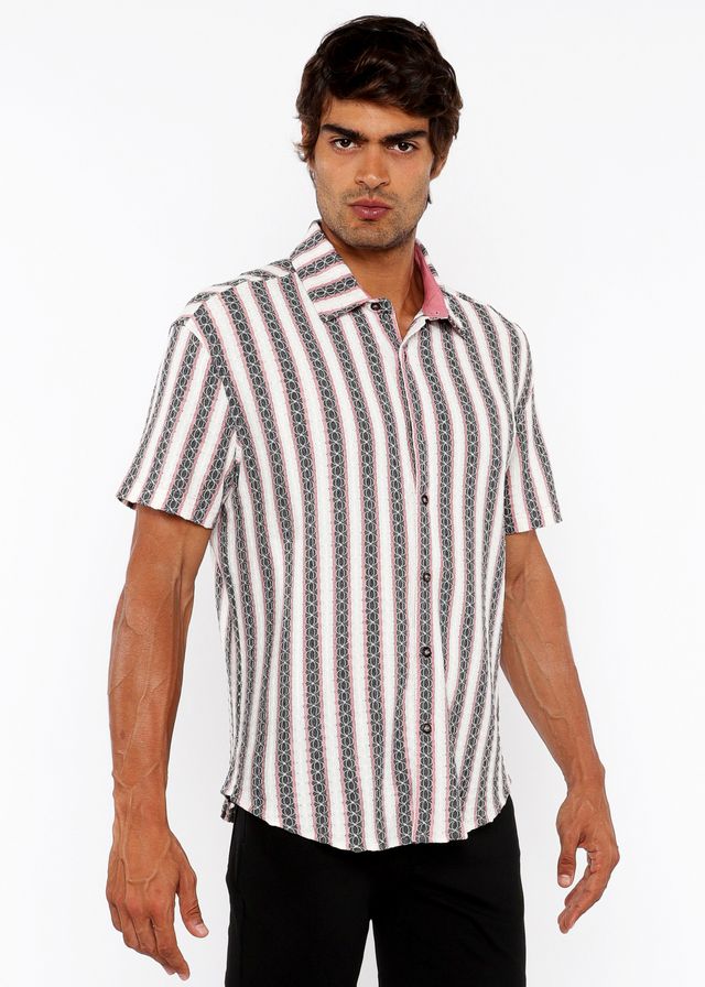 A man wearing a zigzag stripe open stretch knit shirt with white gray and black geometric vertical stripes