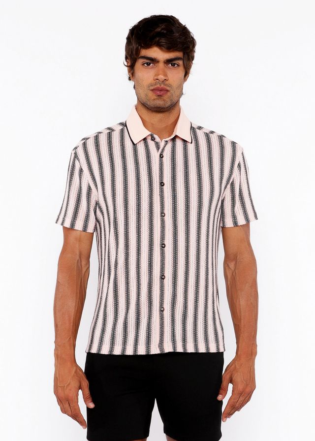 A man wearing a vertical stripe open stretch knit shirt with rib collar in black and off-white colors