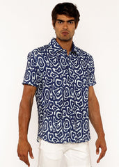 A navy blue squiggly print open knit short-sleeved button-up shirt with a white abstract pattern