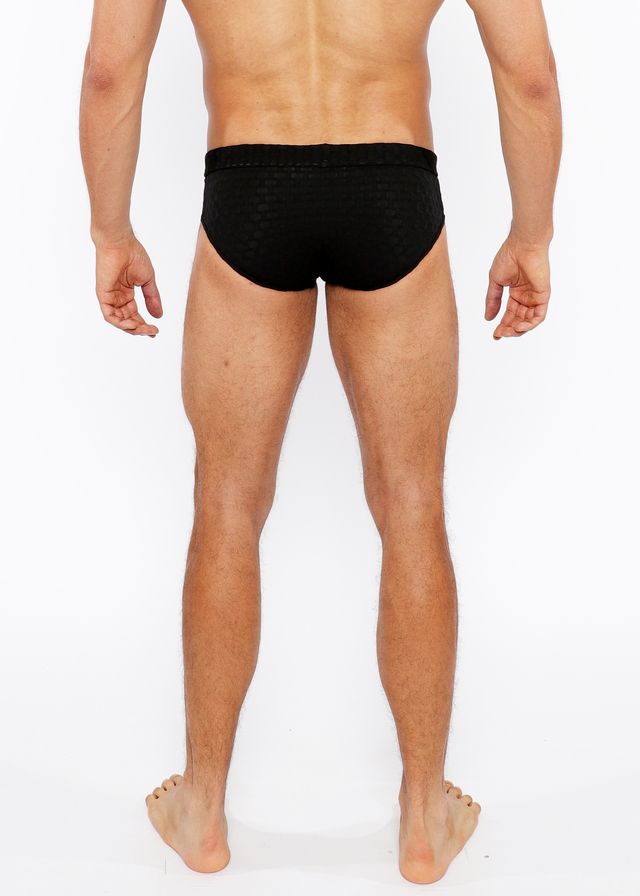 Black textured swim brief with front buckle detail made from durable fabric for swim and beachwear use