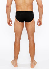 Black textured swim brief with front buckle detail made from durable fabric for swim and beachwear use