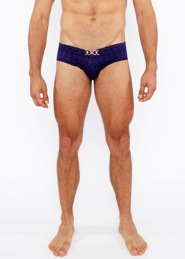 Deep blue velvet textured swim brief with a silver metallic x shaped front buckle for stylish swimwear