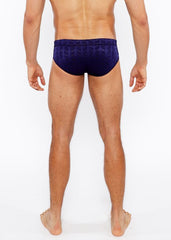 Navy blue textured swim brief with front buckle and geometric pattern ideal for stylish beachwear