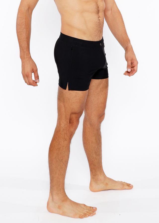 Black pinstripe swim short featuring sleek form-fitting athletic design with subtle side slits for enhanced comfort