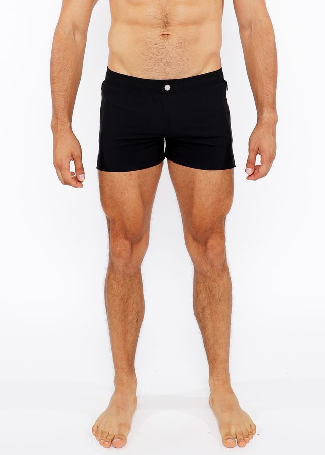 Black pinstripe swim short with a white button at the waistband made for comfortable swimming and beachwear