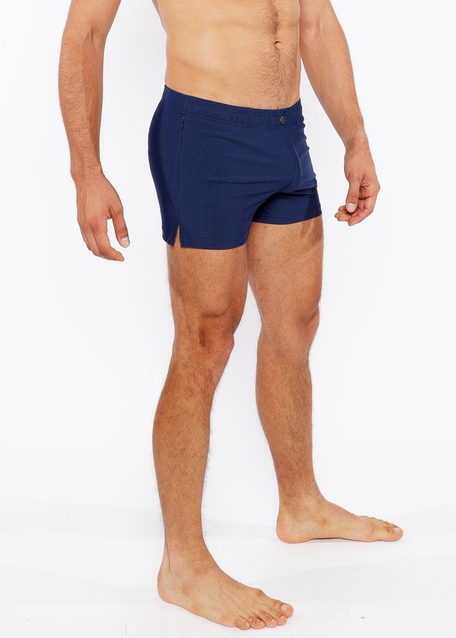 Navy blue pinstripe swim short with button closure at the waist designed for comfortable beachwear