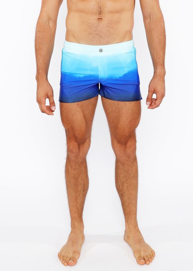 Gradient printed swim short featuring blue ombre swim trunks with a white waistband for comfortable beachwear